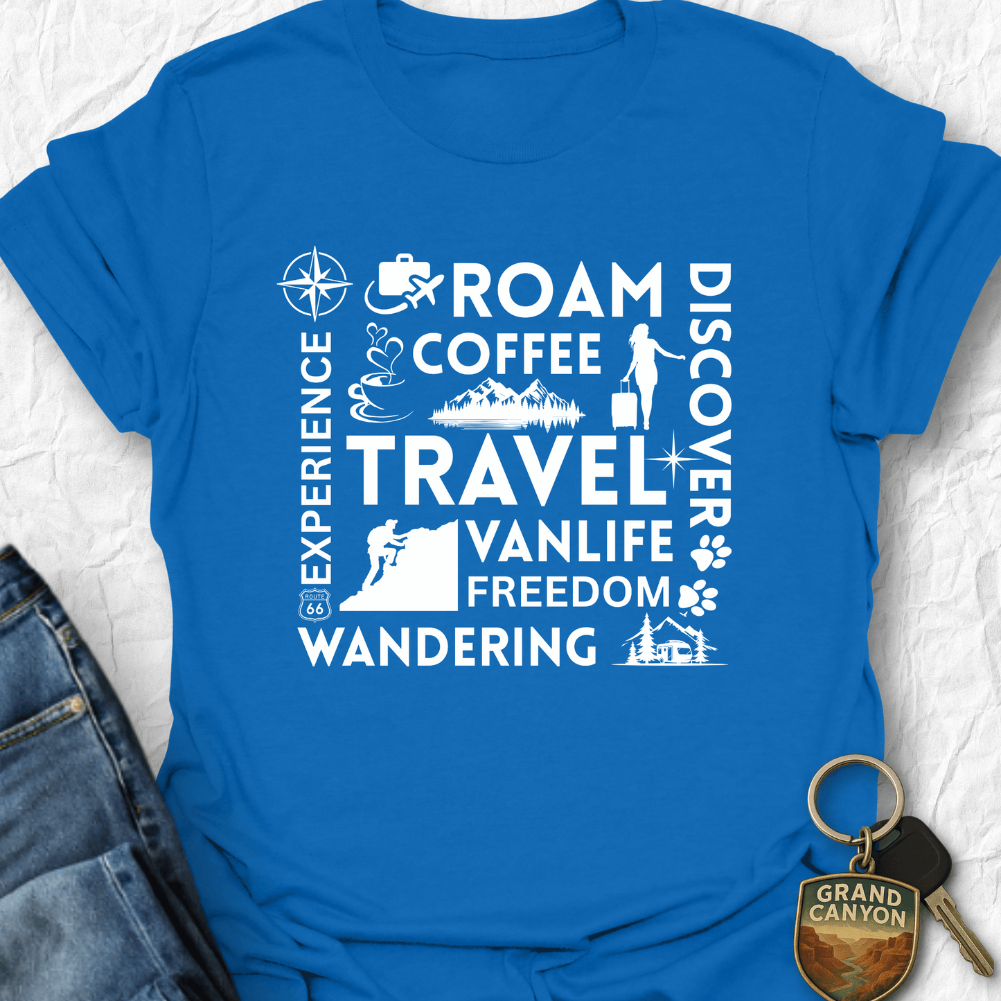 Blue t-shirt with white text and graphics on a textured surface