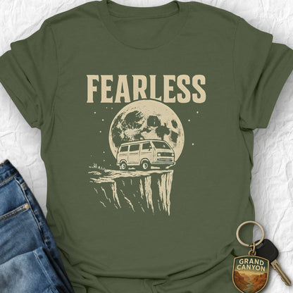 Green t-shirt with 'FEARLESS' graphic design featuring a van and moon, displayed with jeans and keys.