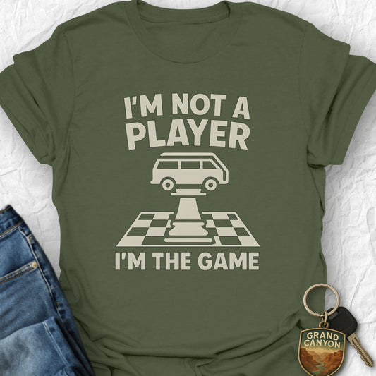 Green t-shirt with 'I'm not a player, I'm the game' text and graphic on a white background