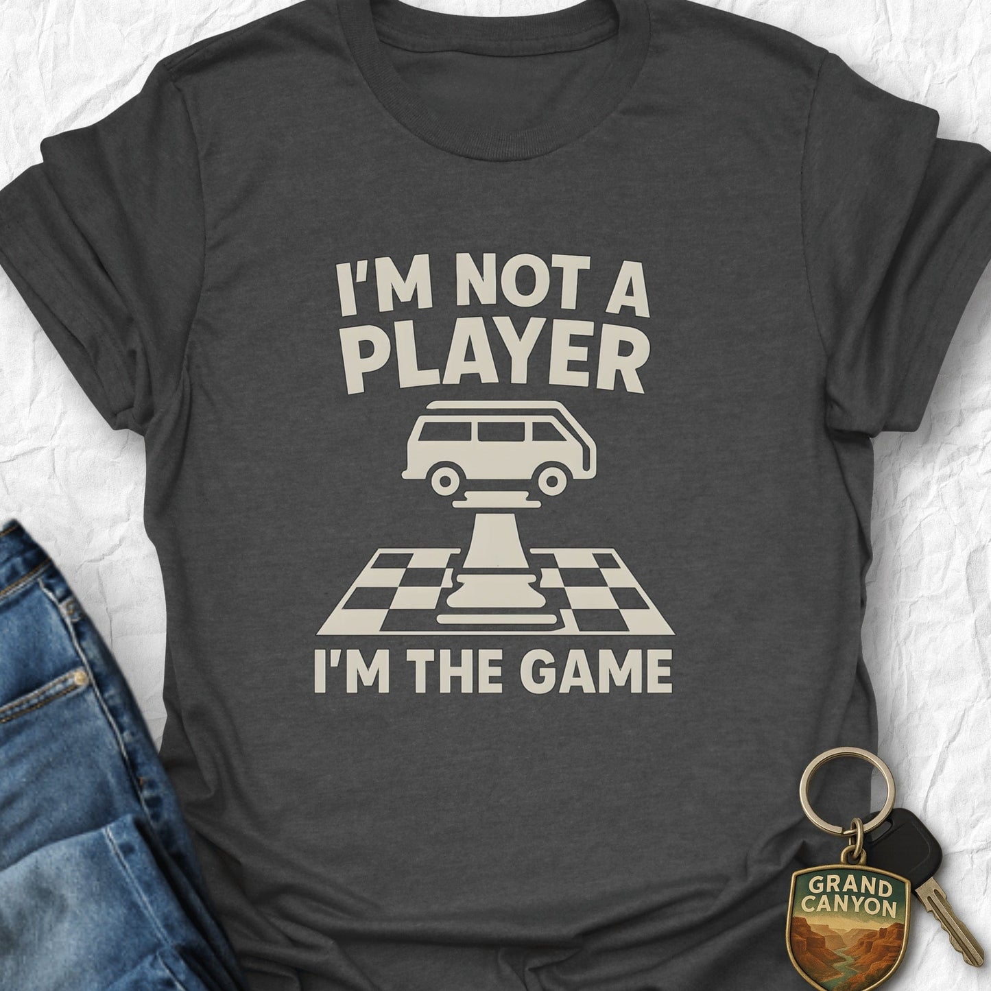 Gray t-shirt with 'I'm not a player, I'm the game' design on a white background