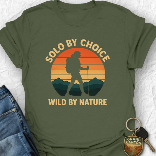 Green t-shirt with 'Solo by choice, wild by nature' design on a white background