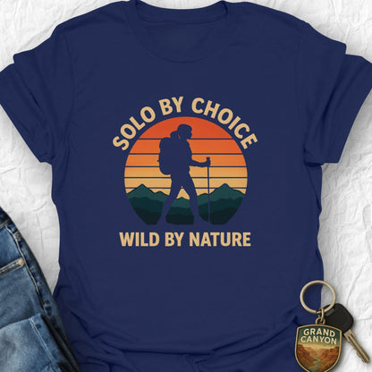 Navy blue t-shirt with 'Solo by choice, wild by nature' design on a white background