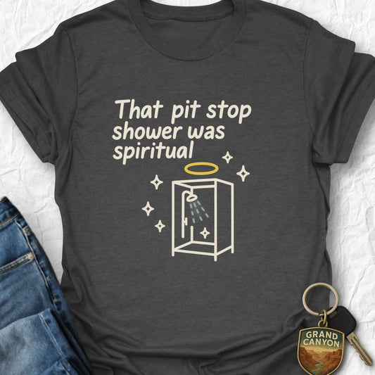 Dark gray t-shirt with humorous graphic and text, paired with jeans and a keychain.