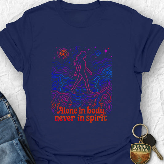 Navy blue t-shirt with colorful graphic and text 'Alone in body, never in spirit' on a textured white background.