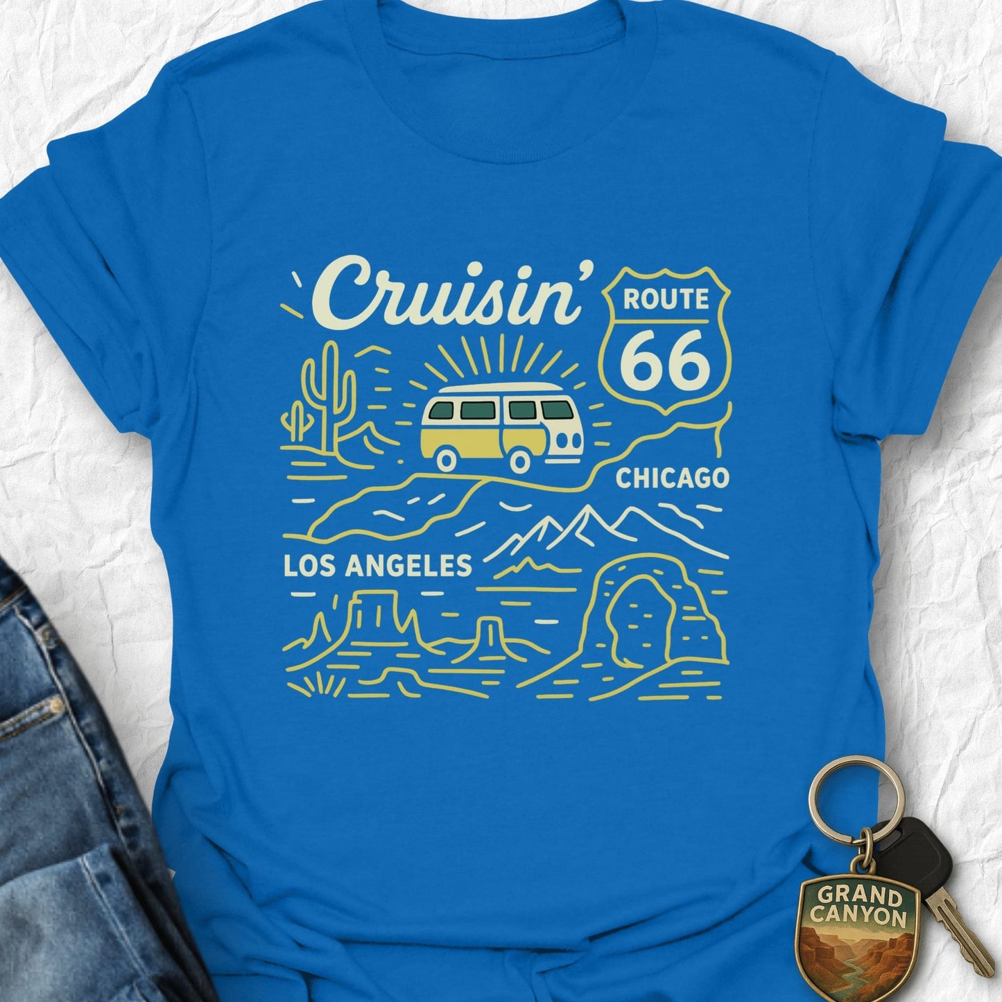 Blue t-shirt with Route 66 graphic design on a textured white background