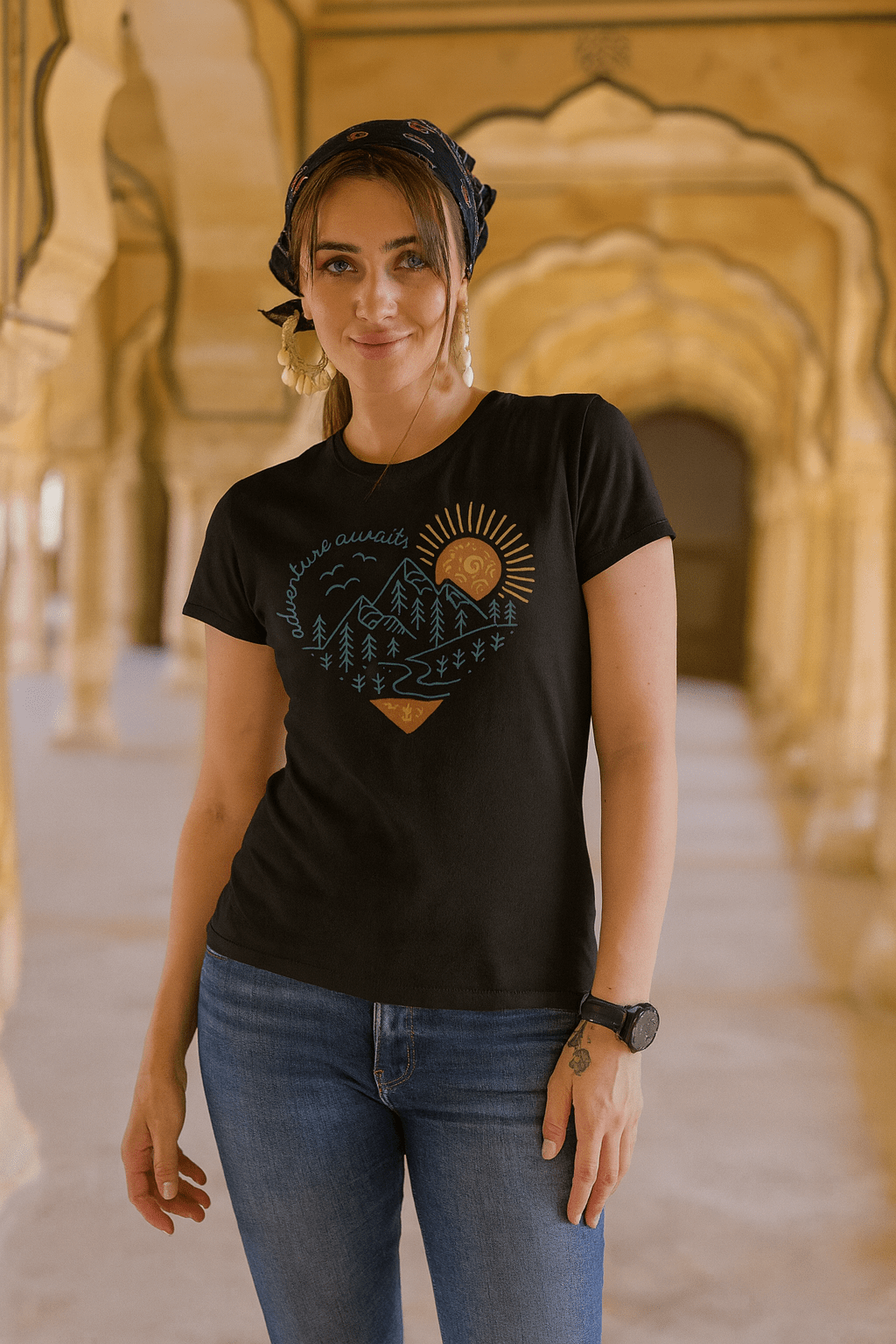 Woman wearing a black t-shirt with a design in an ornate architectural setting