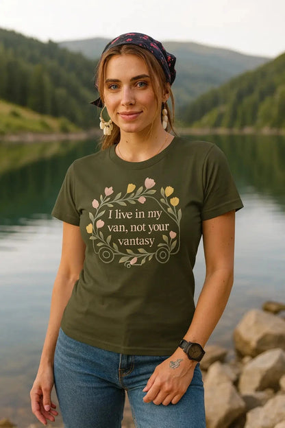 Woman wearing a green t-shirt with a quote by a lake