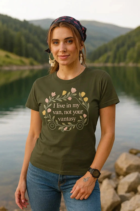 Woman wearing a green t-shirt with a quote by a lake